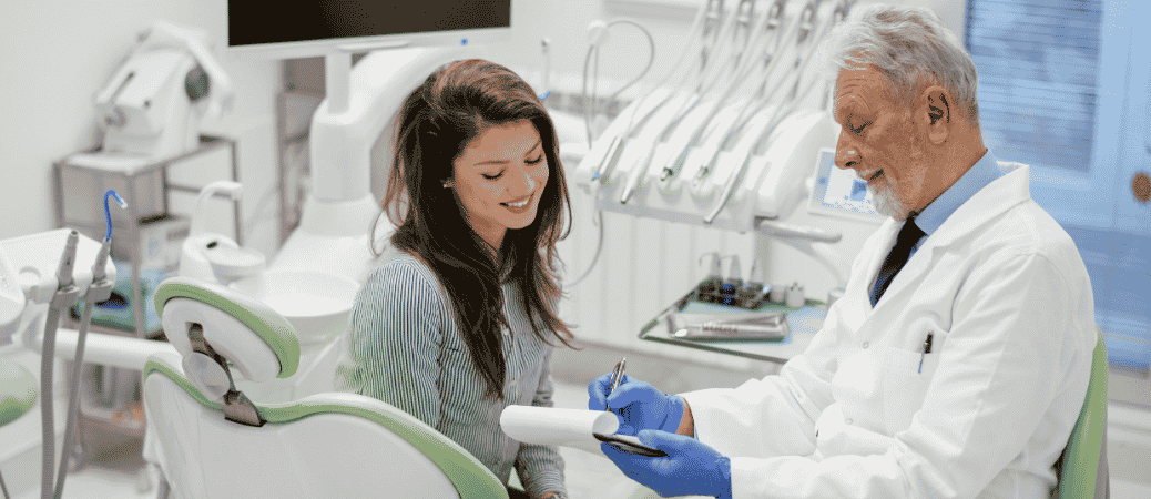 Dentist reviewing IV sedation instructions with a patient