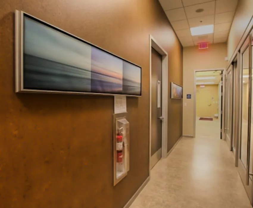 Hallway with landscape artwork