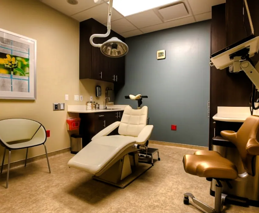 Treatment room with patient chair and cabinetry