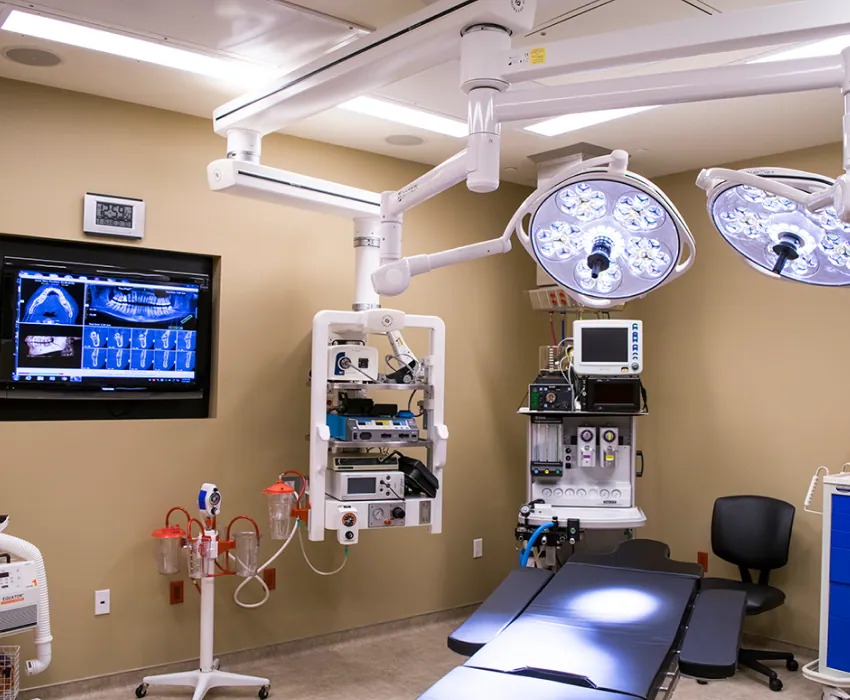 Operating room with surgical lights and monitors