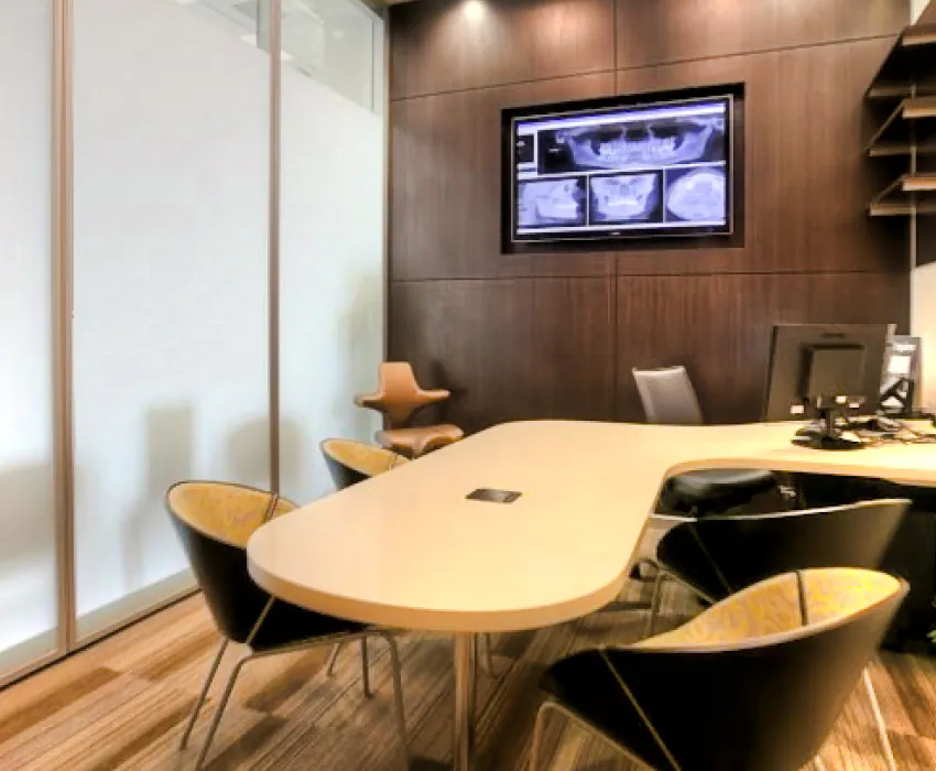 Consultation room with table and X-ray display
