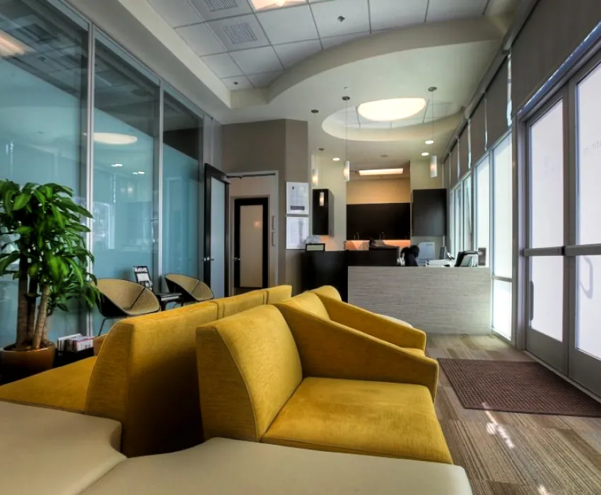 Lobby with yellow sofas and potted plant