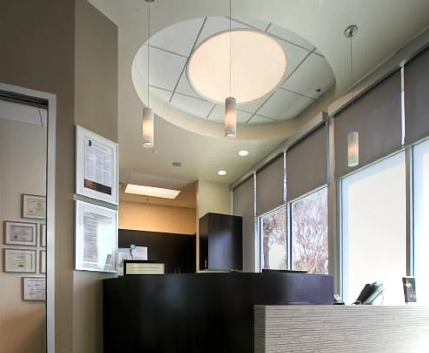 Front reception desk under a round ceiling light